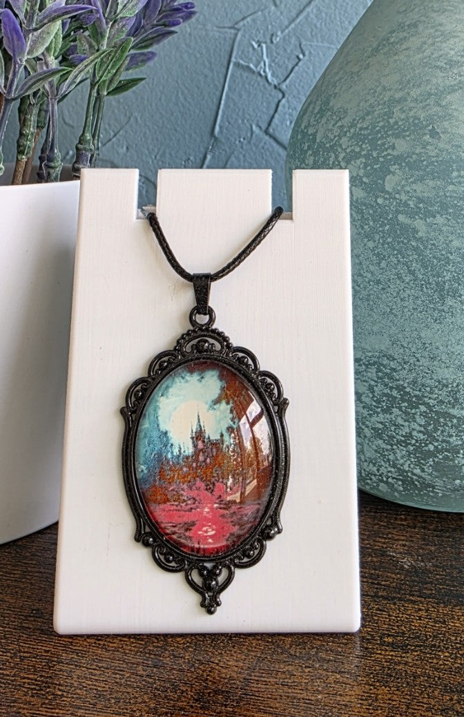 Antique pendant necklace with image of haunted mansion
