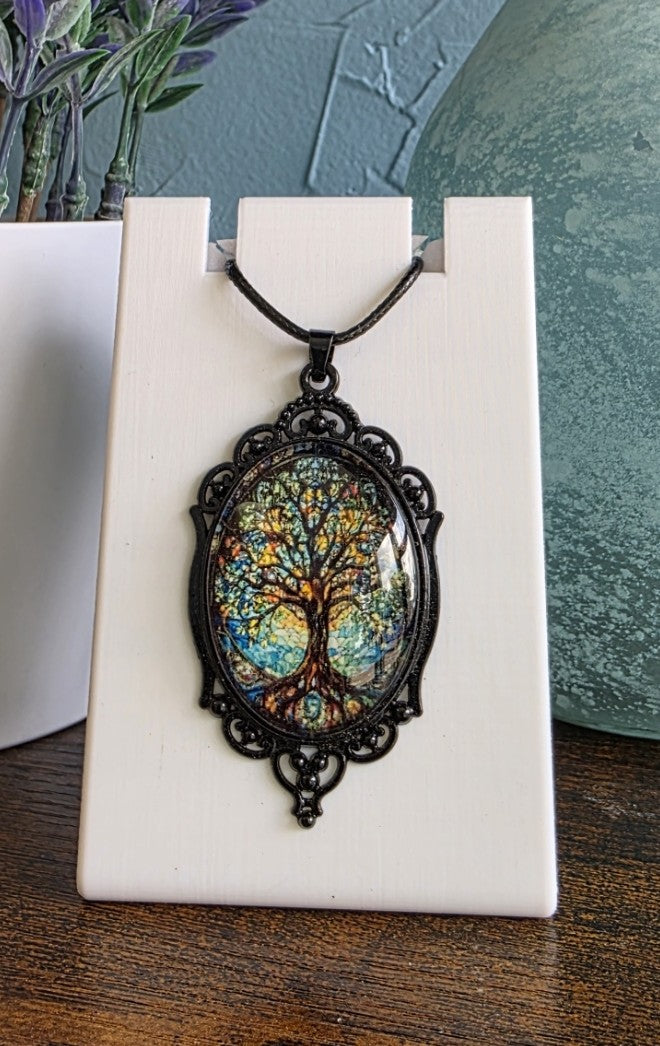 Antique pendant necklace with image of Tree of Life gothic mystic
