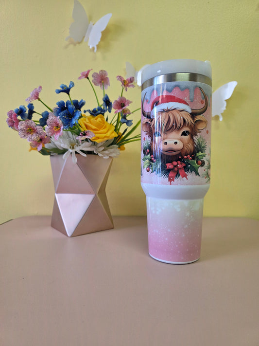 Christmas Highland Cow Santa 40 Ounce Stainless Steel Tumbler Pink on a yellow background