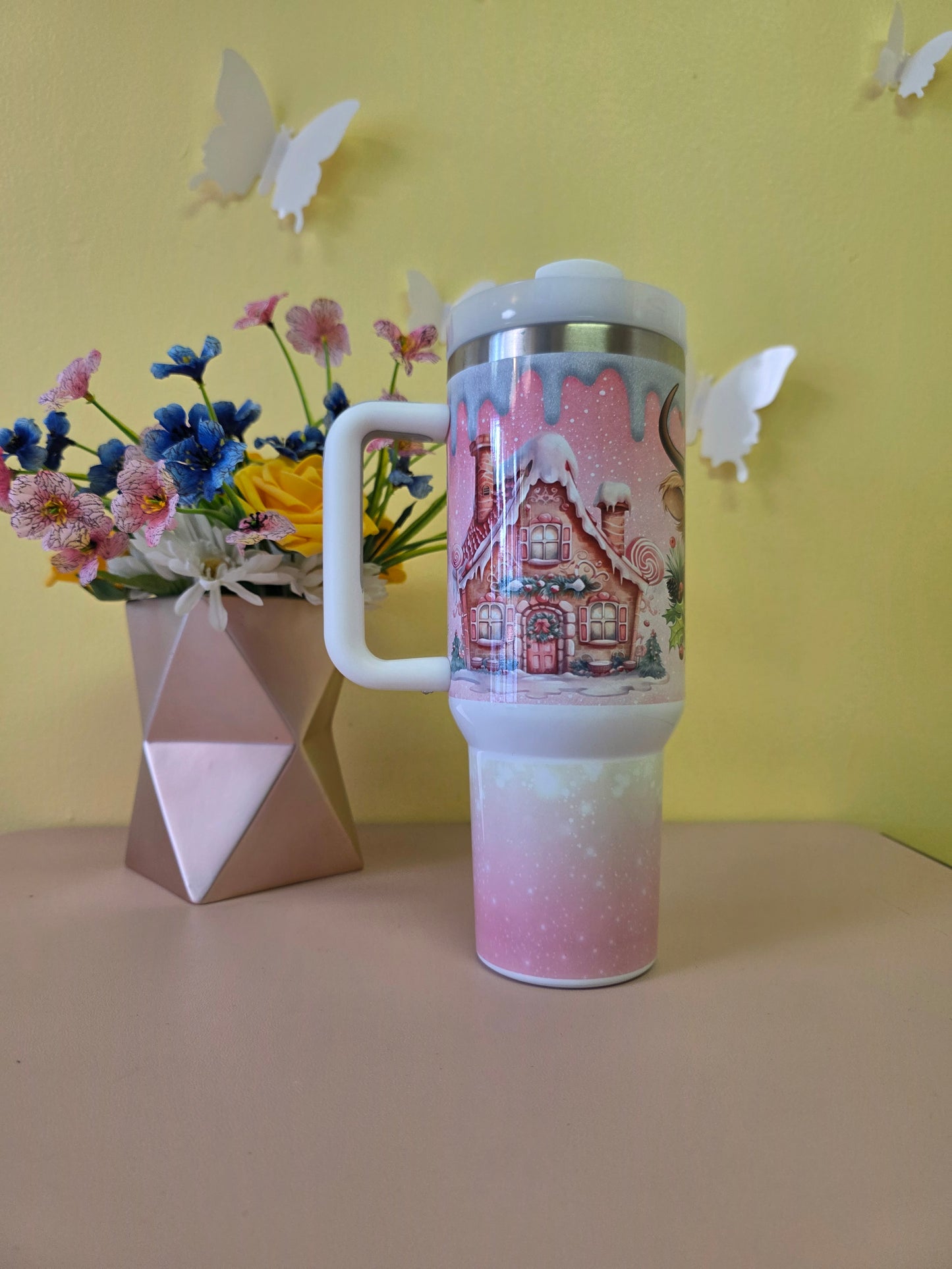 Christmas Highland Cow Santa 40 Ounce Stainless Steel Tumbler Pink on a yellow background