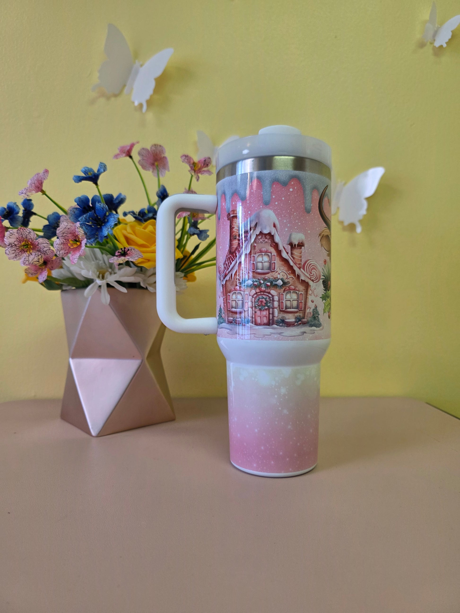 Christmas Highland Cow Santa 40 Ounce Stainless Steel Tumbler Pink on a yellow background