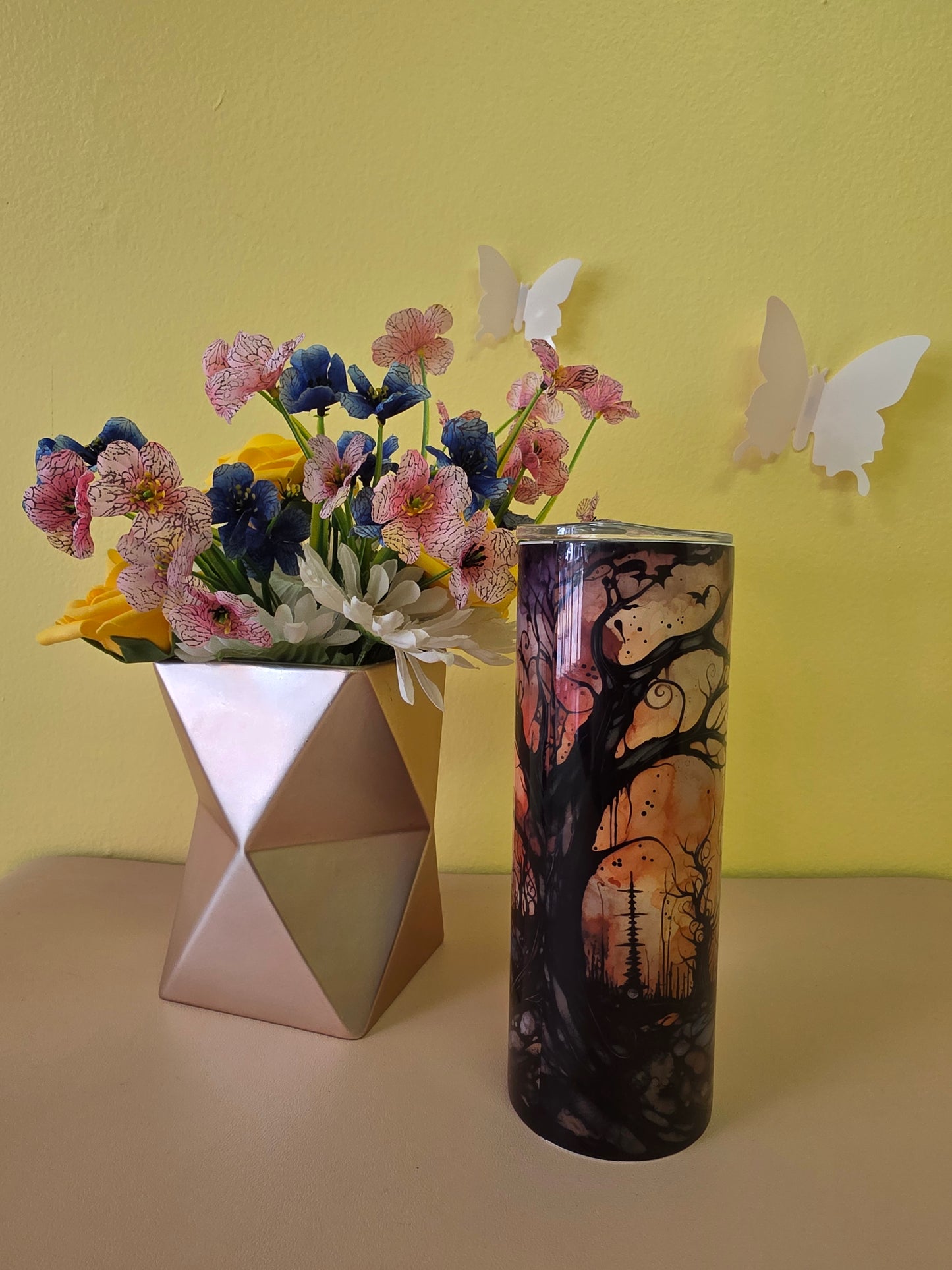 Halloween stainless steel tumbler twenty ounces with black and orange graveyard and pumpkin design