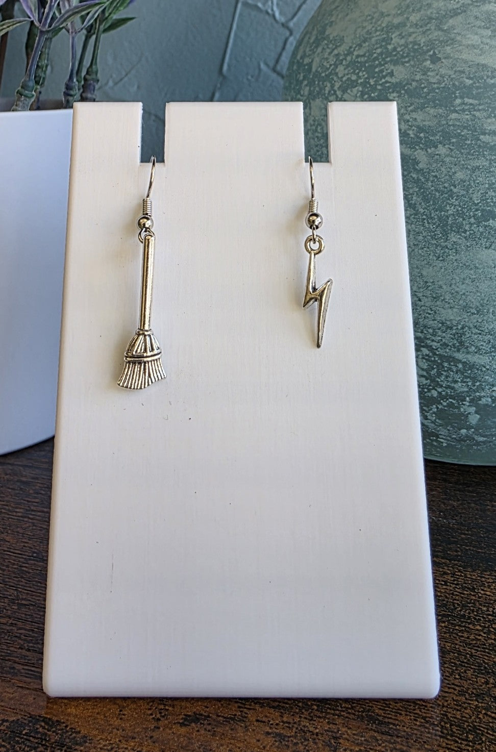 Silver mismatch earrings with broom and lightning bolt Harry Potter