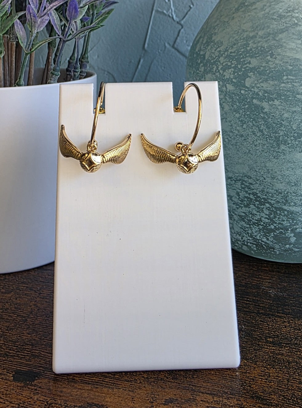 Harry Potter gold hoop dangle earrings with golden snitch.