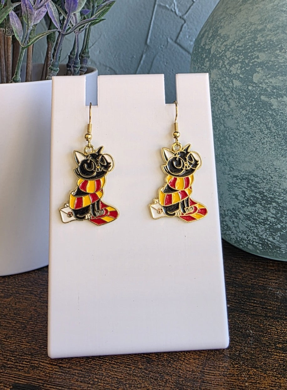 Harry Potter earrings with Hermione's cat Crookshanks in Gryffindor scarf.