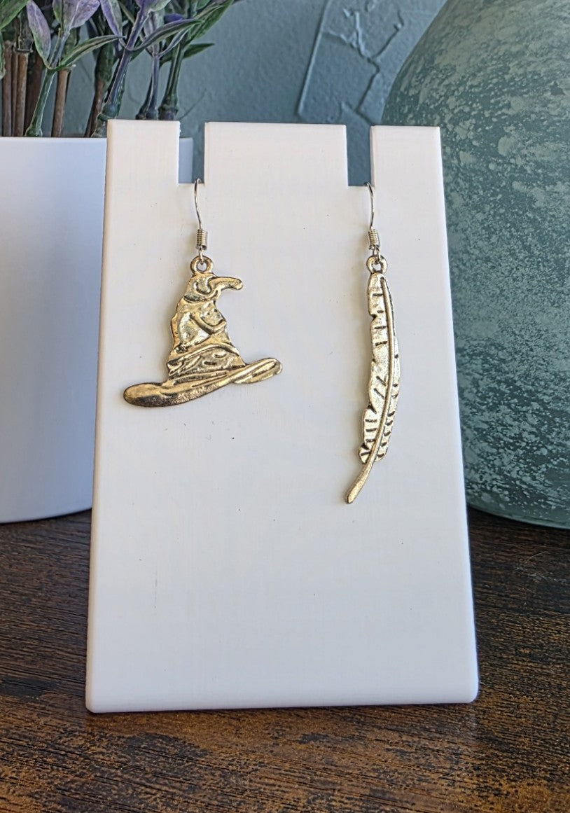 Harry Potter silver mismatch earrings with Sorting Hat and Buckbeak Feather