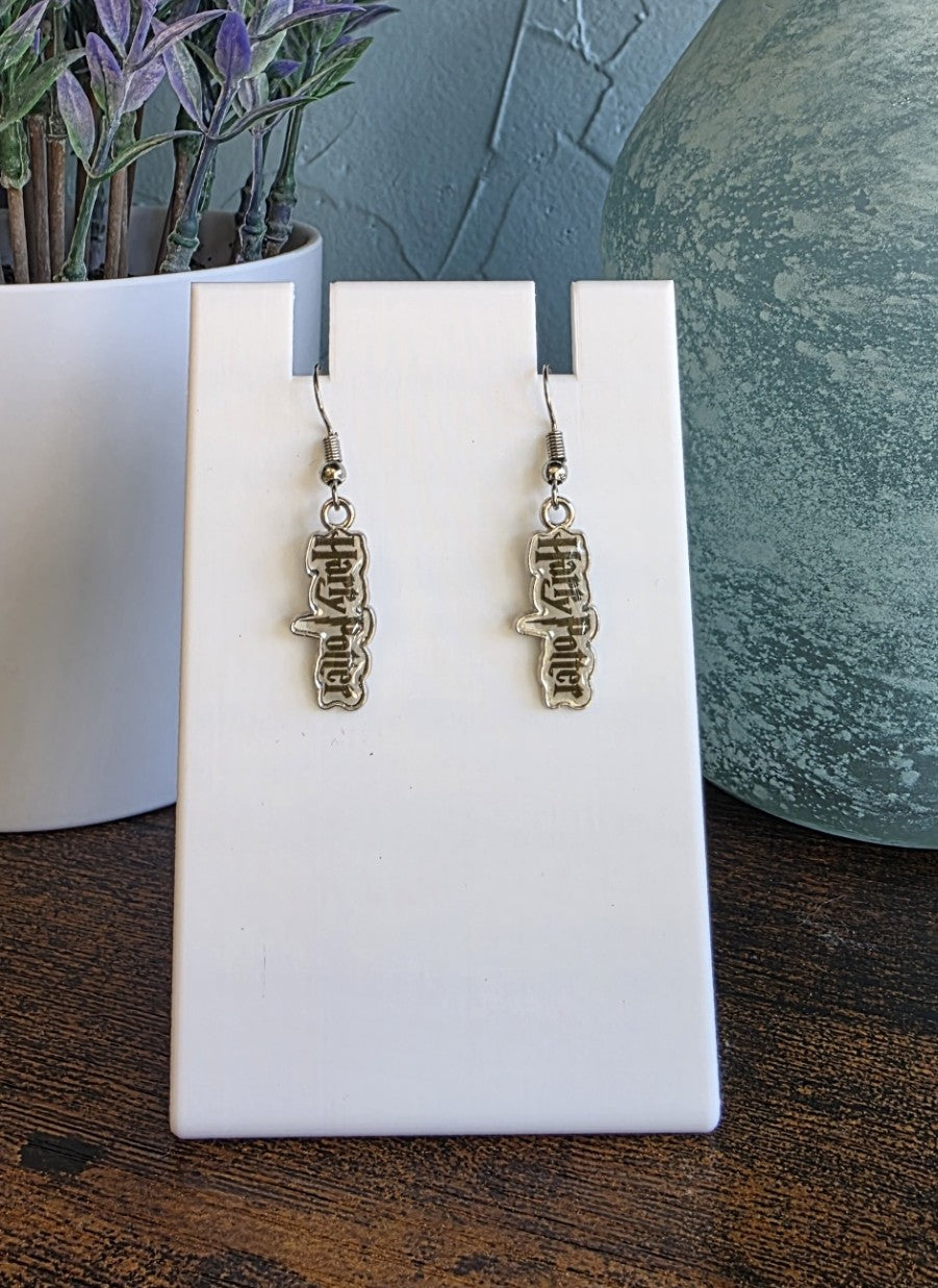 Harry Potter logo earrings with silver finishes.