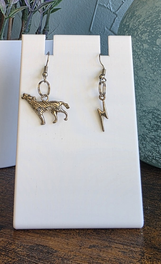 Harry Potter silver mismatch earrings featuring Padfoot and lightning bolt.