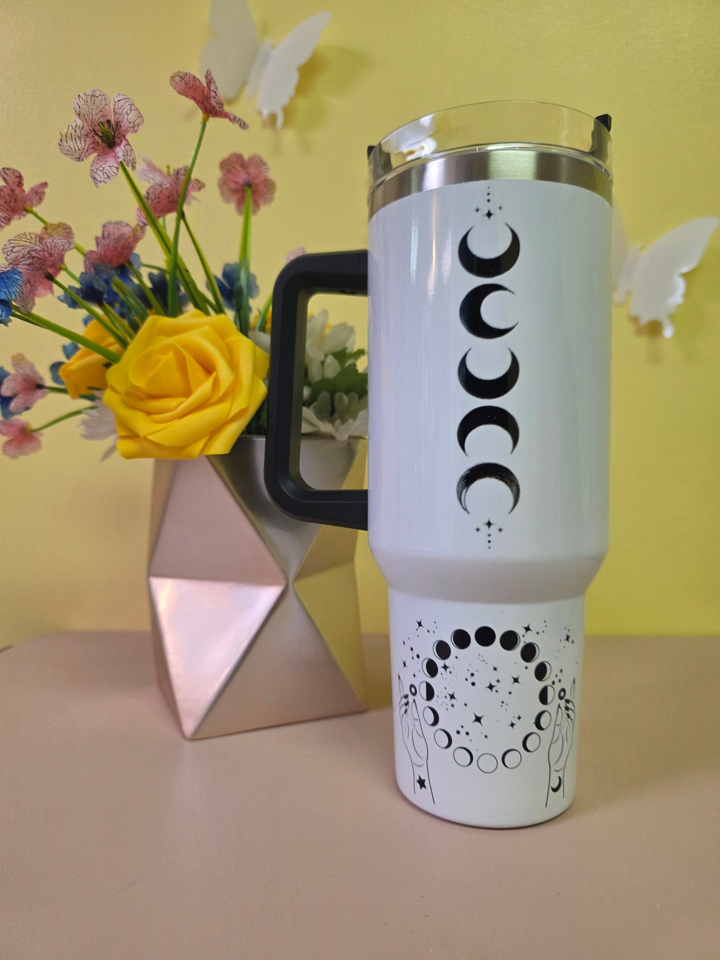Salem Witch Trials tumbler on a pink surface with yellow background
