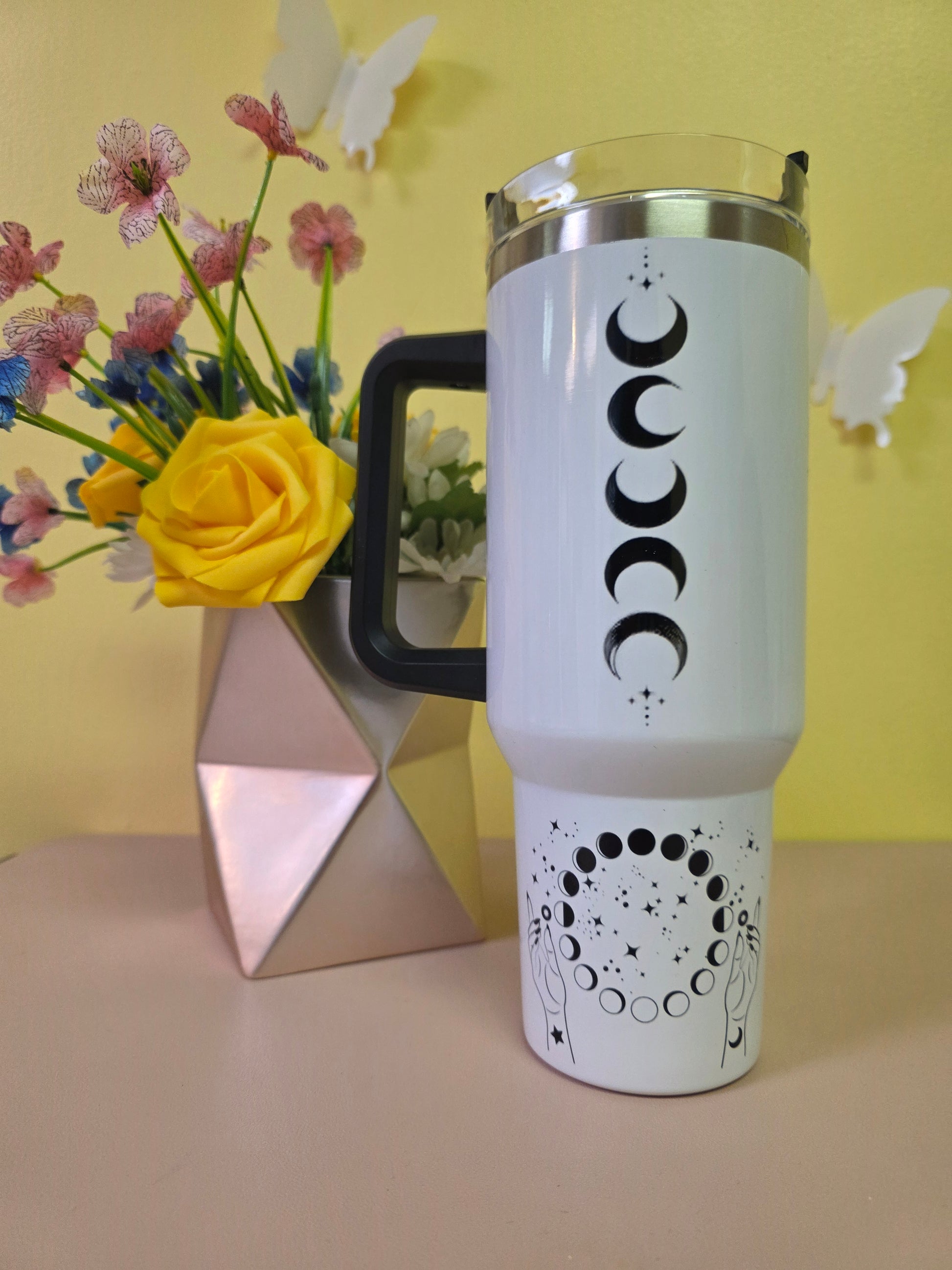 Salem Witch Trials tumbler on a pink surface with yellow background