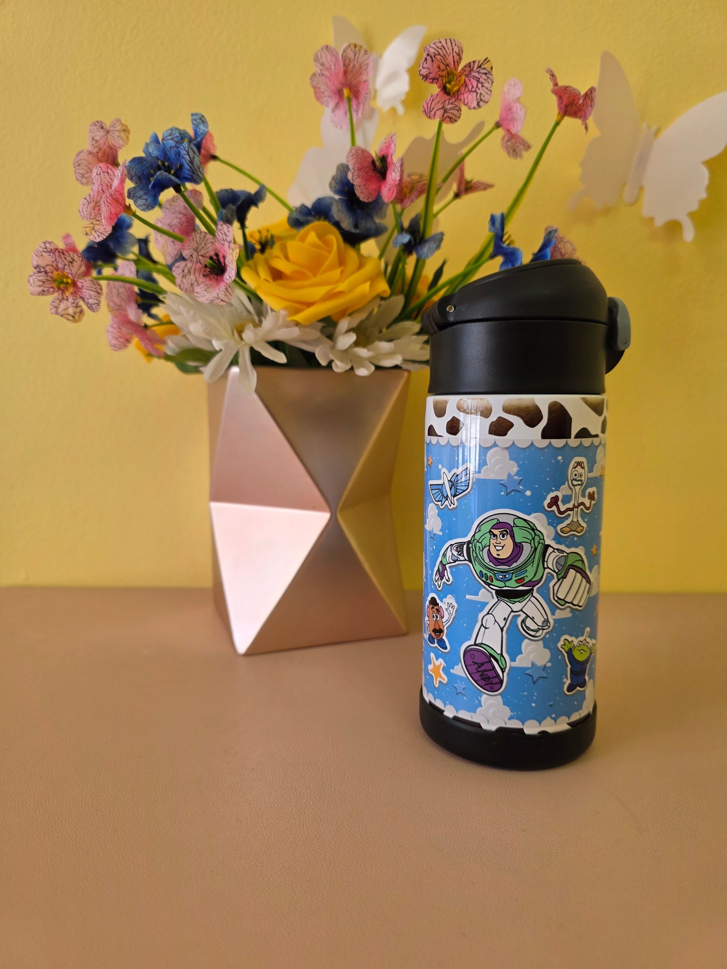 Toy Story themed tumbler on a table.