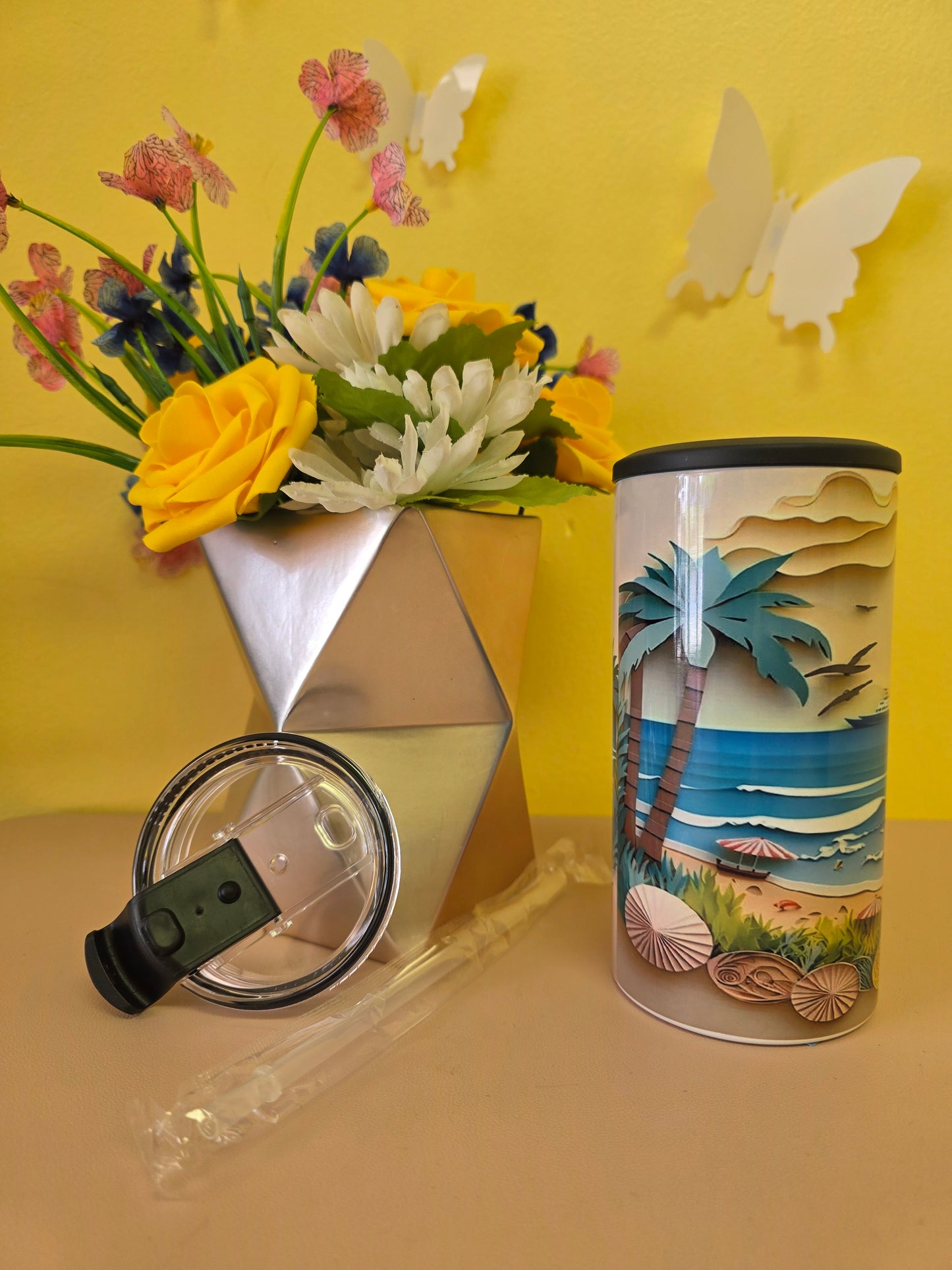 4‑in‑1 insulated stainless steel tumbler with clay‑style beach scene featuring sun, sailboat, waves, and seashells