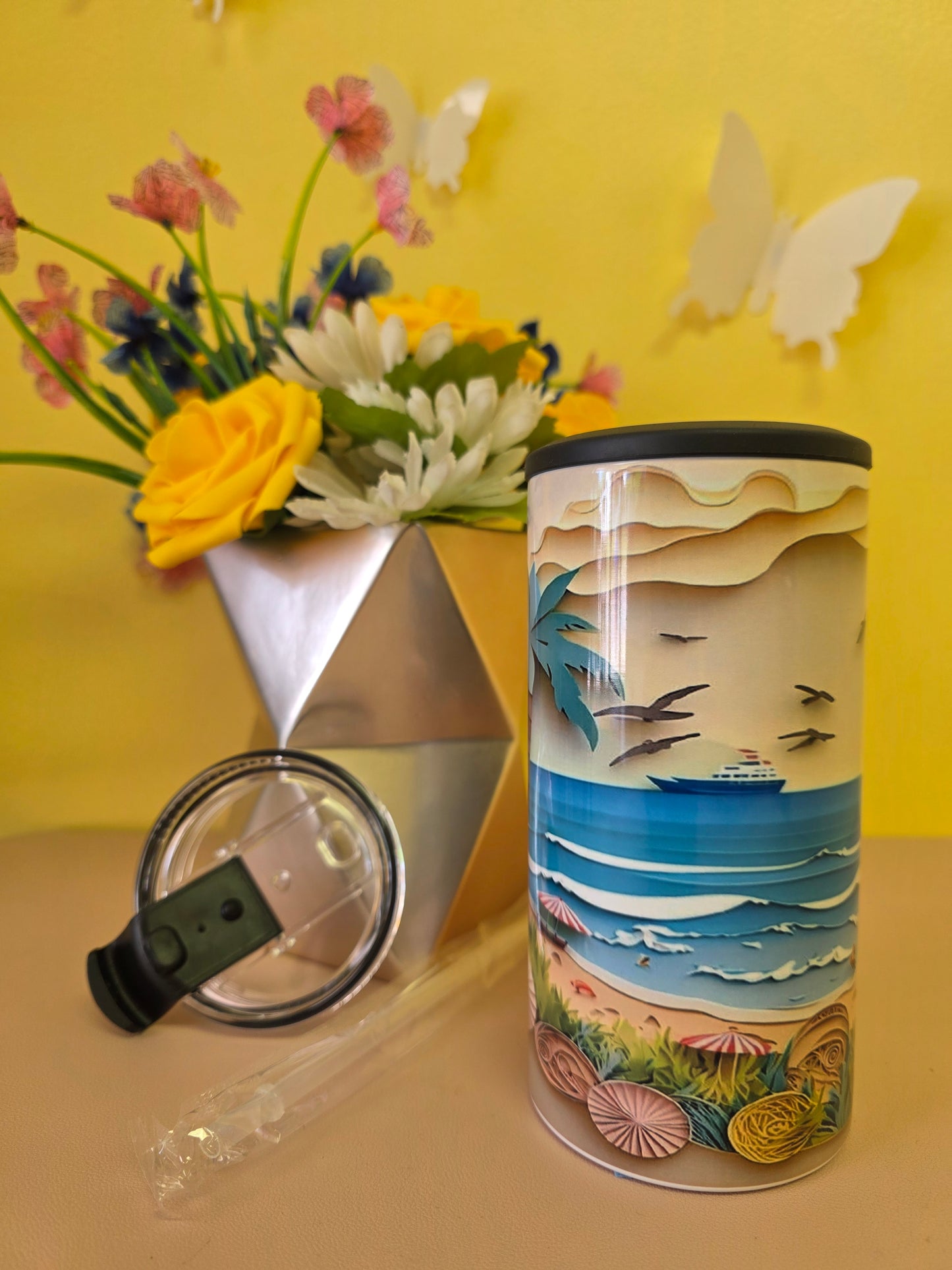 4‑in‑1 insulated stainless steel tumbler with clay‑style beach scene featuring sun, sailboat, waves, and seashells