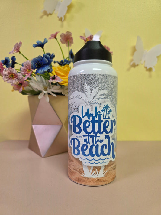Bottle labeled 'Better at the Beach' with flowers on a yellow and beige background
