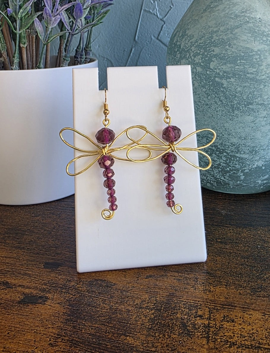 Dragonfly-shaped earrings with red beads 