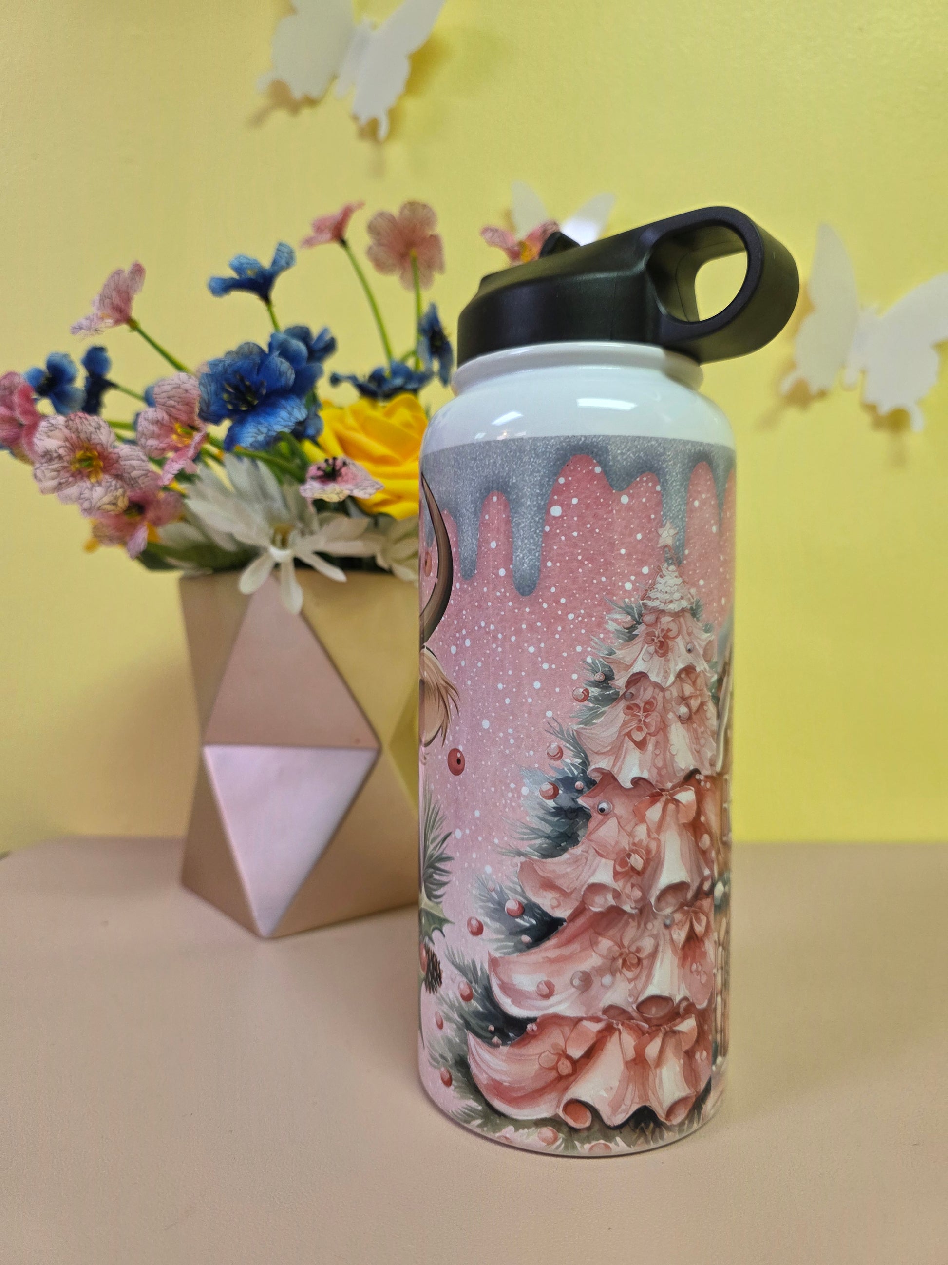 Water bottle with floral design on a yellow and beige background