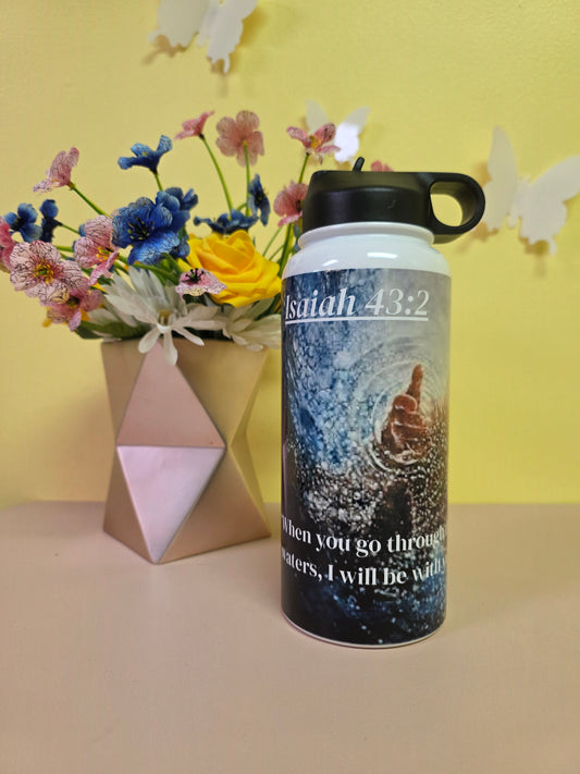 Black water bottle with a scenic design on a yellow and pink background