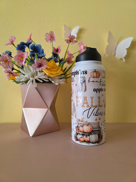 Fall themed water bottle on a table with yellow background