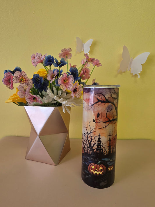 Halloween stainless steel tumbler twenty ounces with black and orange graveyard and pumpkin design