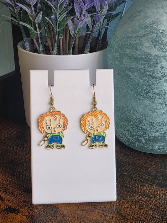 Pair of earrings depicting cartoon Chucky/Child's Play character.