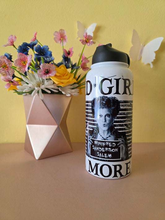 Hocus Pocus water bottle on a pink table with yellow background with flowers