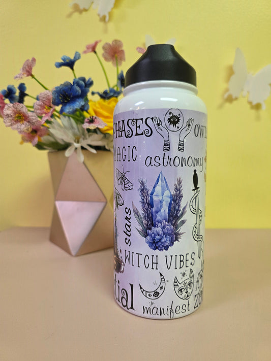 Metaphysical crystal water bottle on a pink table with yellow background. 