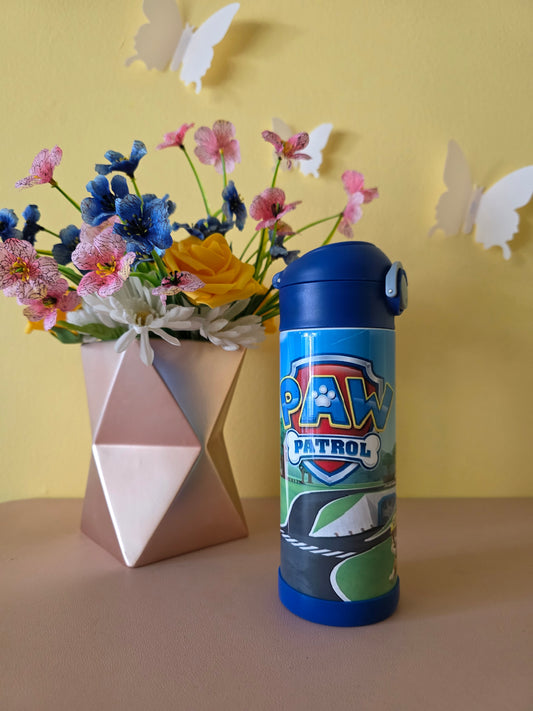 Paw Patrol Kids Tumbler on a table with yellow background
