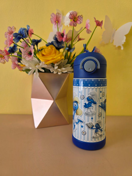 Blue water bottle with cartoon design next to a bouquet of flowers on a yellow background