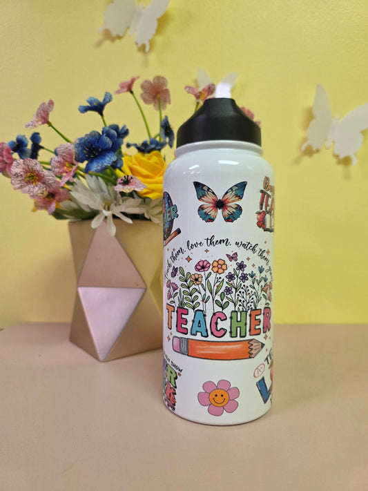 Decorative water bottle with colorful designs on a yellow background