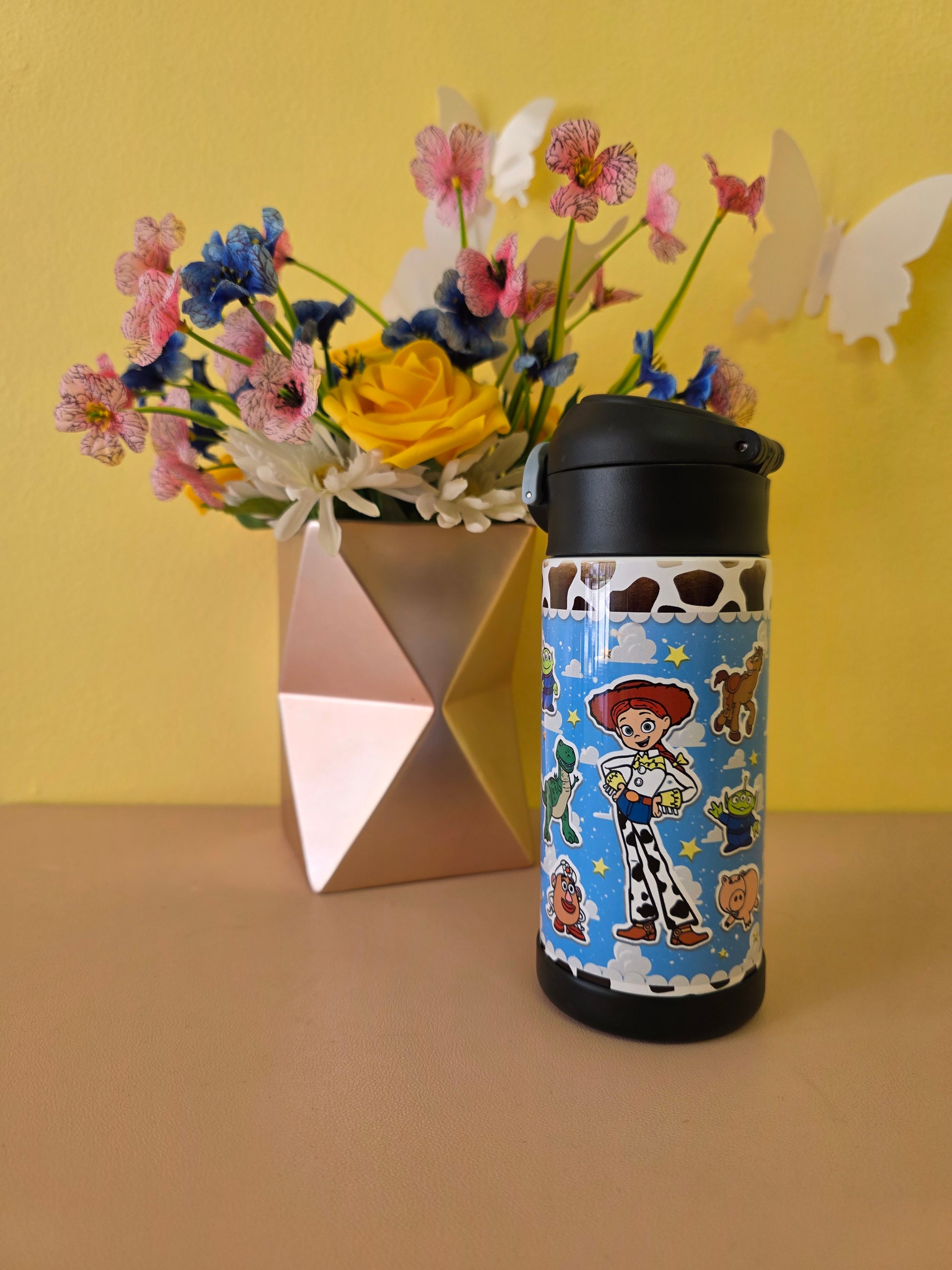 Toy Story themed tumbler on a table. 